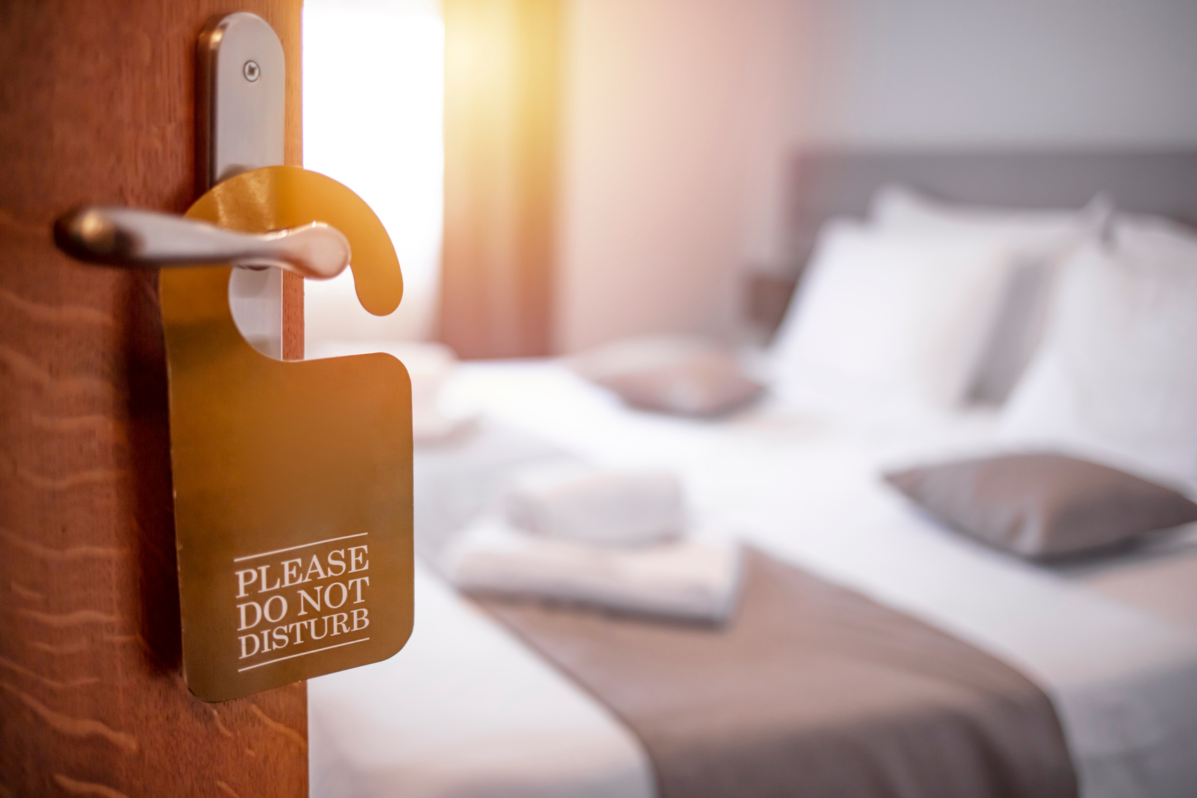 Hotel Room Door with Please Do Not Disturb Sign